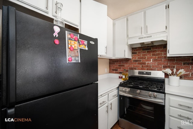 2105 Pinion Springs Cir Unit D, Bakersfield, CA 93309 - kitchen with stainless steel gas stove, freestanding refrigerator, under cabinet range hood, light countertops, and decorative backsplash