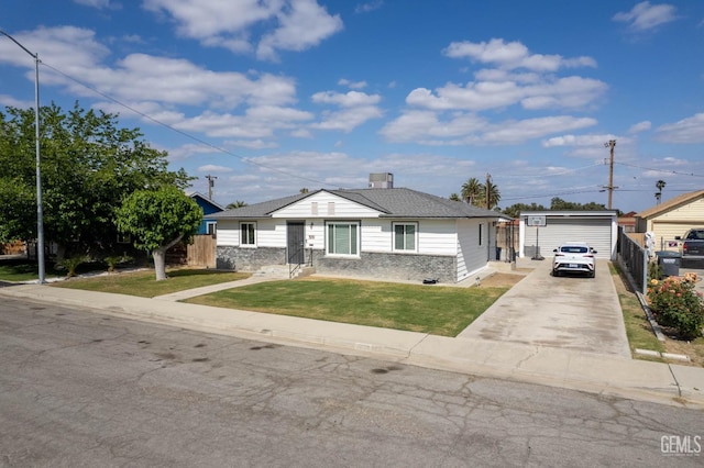 bungalow-style house with fence, a front yard, and concrete driveway
