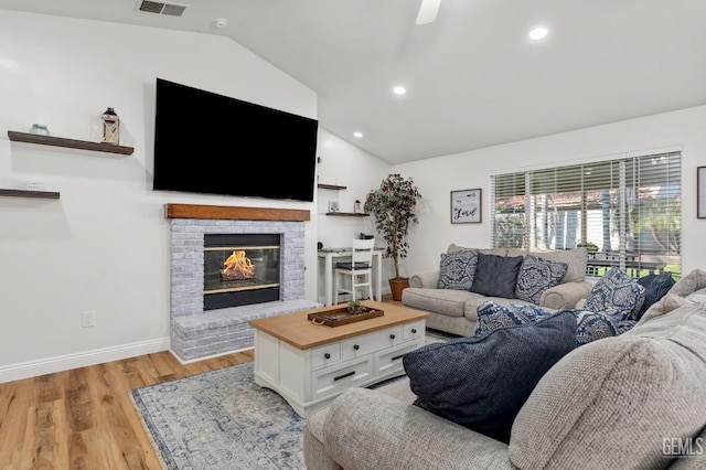 11106 Mohican Dr, Bakersfield, CA 93312 - living area with recessed lighting, a fireplace, vaulted ceiling, and light wood-type flooring