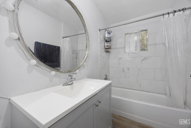 339 Ray St, Bakersfield, CA 93308 - full bathroom with vanity, shower / bath combo with shower curtain, and wood finished floors