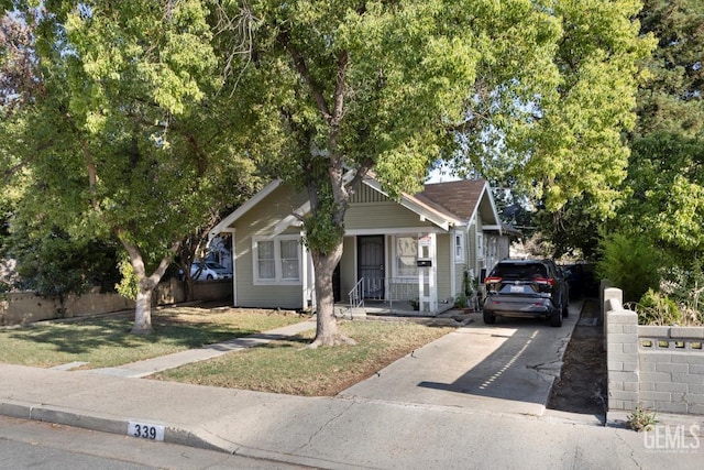 339 Ray St, Bakersfield, CA 93308 - view of front facade featuring concrete driveway and covered porch