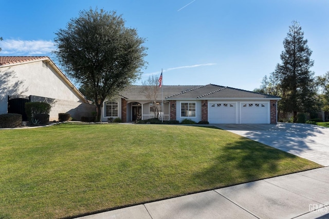 ranch-style home featuring a garage and a front lawn