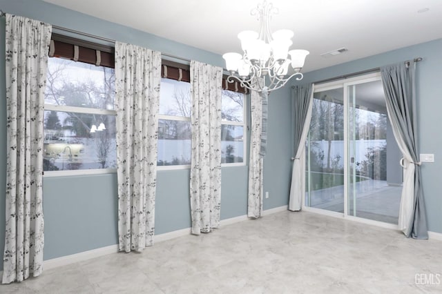 2624 Oakley St, Bakersfield, CA 93311 - spare room featuring a chandelier and baseboards