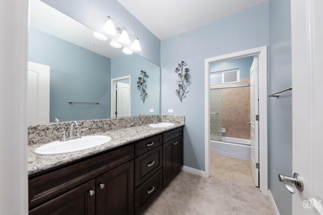 2624 Oakley St, Bakersfield, CA 93311 - full bath featuring double vanity, bath / shower combo with glass door, baseboards, and tile patterned flooring