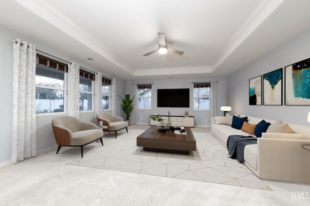 2624 Oakley St, Bakersfield, CA 93311 - living room featuring a raised ceiling, ceiling fan, light carpet, and baseboards
