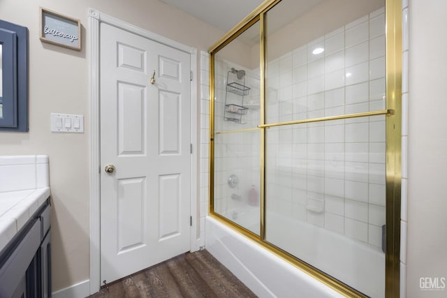 3404 Medallion Rose Ave, Bakersfield, CA 93313 - full bathroom with wood finished floors, vanity, and combined bath / shower with glass door