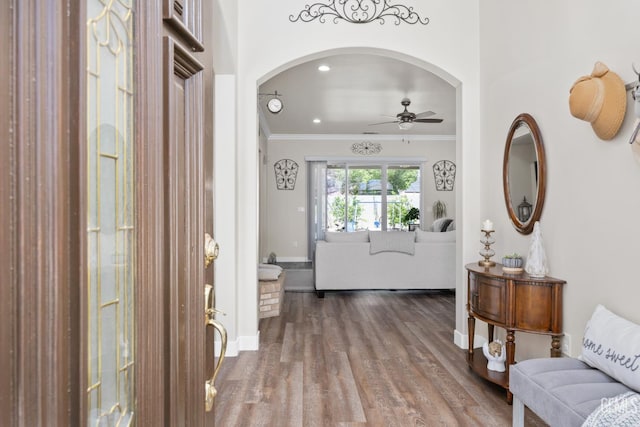 3404 Medallion Rose Ave, Bakersfield, CA 93313 - entrance foyer with a ceiling fan, arched walkways, crown molding, and wood finished floors