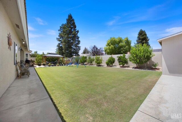 3404 Medallion Rose Ave, Bakersfield, CA 93313 - view of yard featuring a playground, a gazebo, and a patio area