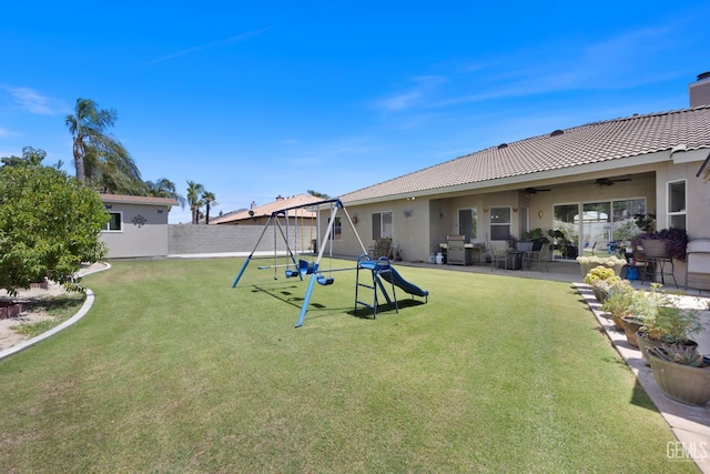 3404 Medallion Rose Ave, Bakersfield, CA 93313 - view of yard featuring a playground, a ceiling fan, and a patio