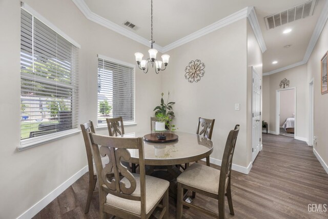 3404 Medallion Rose Ave, Bakersfield, CA 93313 - dining area with ornamental molding, baseboards, wood finished floors, and a chandelier