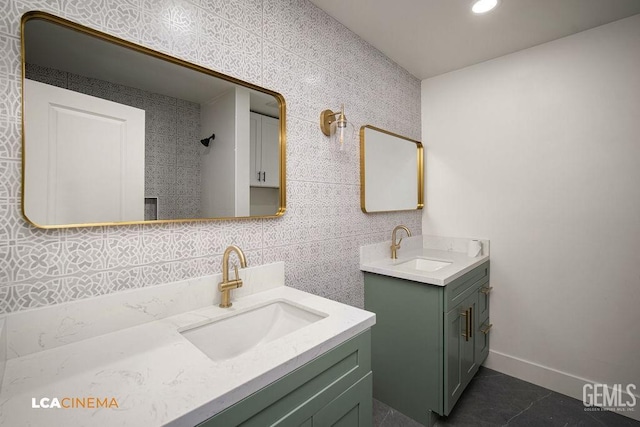 bathroom with vanity and tile walls