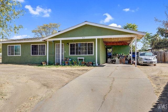 ranch-style house with a carport