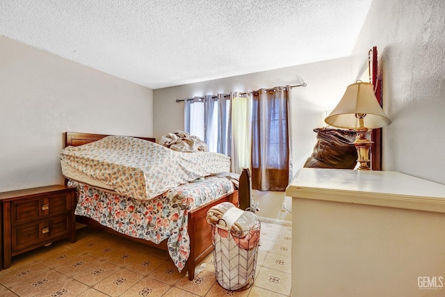 bedroom featuring a textured ceiling