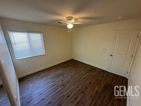 interior space with ceiling fan and dark hardwood / wood-style floors