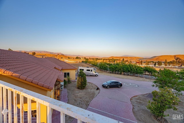 9446 E Kern River Ave, Bakersfield, CA 93308 - yard at dusk featuring a mountain view