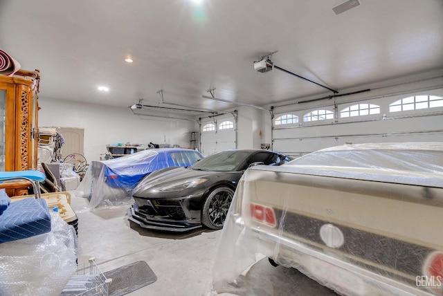 9446 E Kern River Ave, Bakersfield, CA 93308 - garage with a garage door opener and recessed lighting