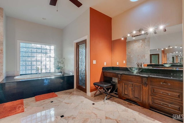 9446 E Kern River Ave, Bakersfield, CA 93308 - bathroom featuring a bath, vanity, and a ceiling fan