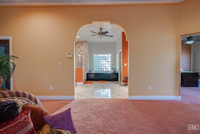 9446 E Kern River Ave, Bakersfield, CA 93308 - carpeted living room featuring arched walkways and ceiling fan