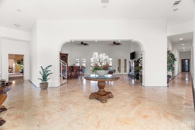 9446 E Kern River Ave, Bakersfield, CA 93308 - entrance foyer with arched walkways, a high ceiling, ceiling fan, marble tiled flooring, and recessed lighting