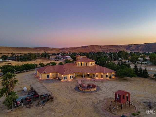 9446 E Kern River Ave, Bakersfield, CA 93308 - aerial view of property and surrounding area with a mountainous background