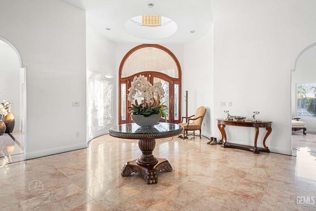 9446 E Kern River Ave, Bakersfield, CA 93308 - foyer featuring arched walkways, a high ceiling, and marble tiled flooring