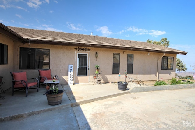 rear view of property with a patio