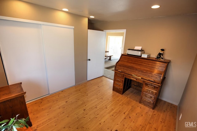 office with light hardwood / wood-style floors