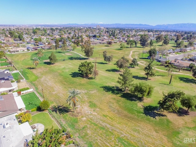 birds eye view of property with a mountain view and a residential view