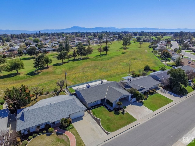 drone / aerial view featuring a mountain view and a residential view