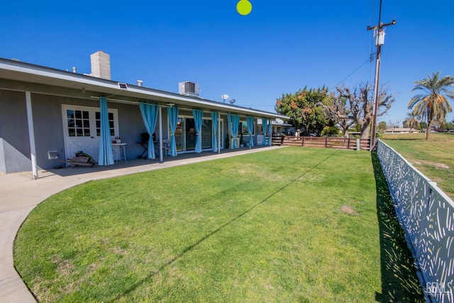 exterior space featuring a patio, central air condition unit, and fence