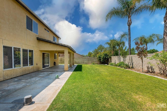 view of yard featuring a patio area and a fenced backyard