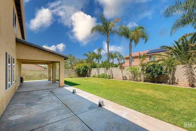 view of yard with a fenced backyard and a patio