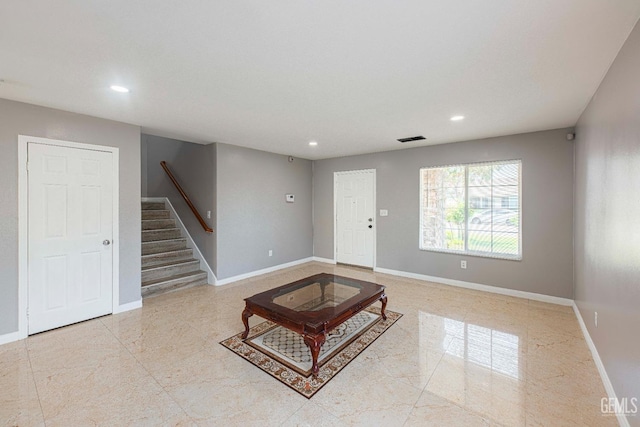 living room with recessed lighting, visible vents, stairway, and baseboards