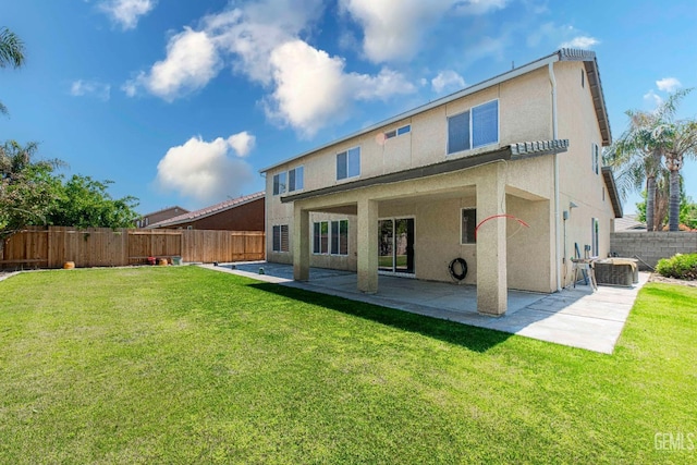 back of house featuring a patio area, a fenced backyard, cooling unit, and a lawn