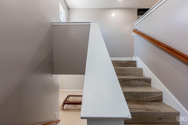 stairway featuring baseboards