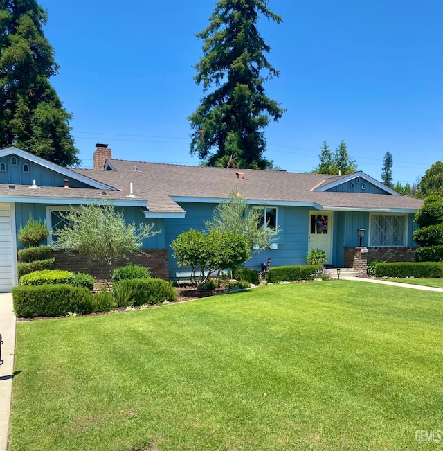 2527 Pine St, Bakersfield, CA 93301 - single story home featuring a front lawn, a chimney, board and batten siding, and roof with shingles