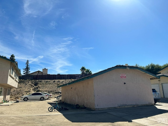 view of side of home featuring stucco siding