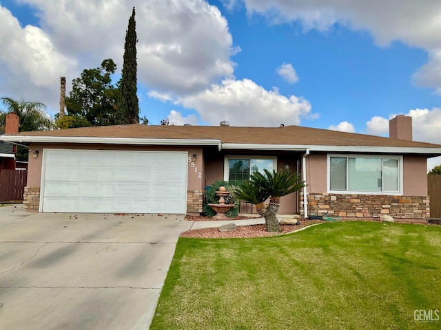 ranch-style house featuring a front yard and a garage