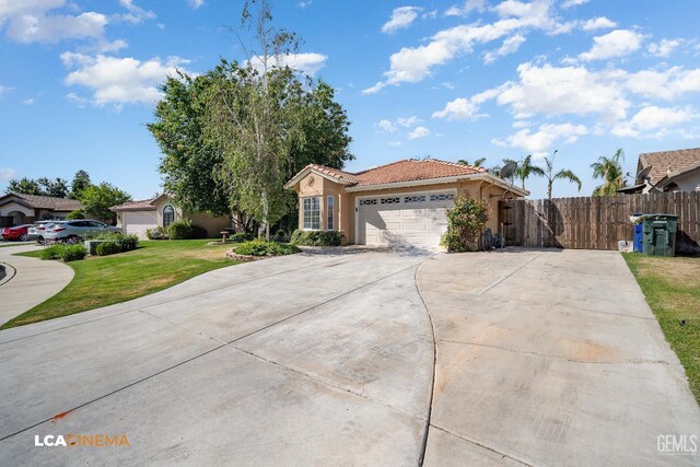 6307 San Rogue Ct, Bakersfield, CA 93312 - view of front of home featuring a tile roof, stucco siding, a garage, and concrete driveway