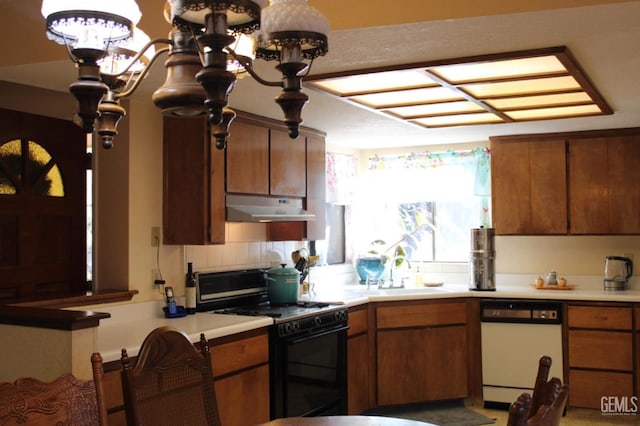 kitchen with gas stove, white dishwasher, tasteful backsplash, and sink