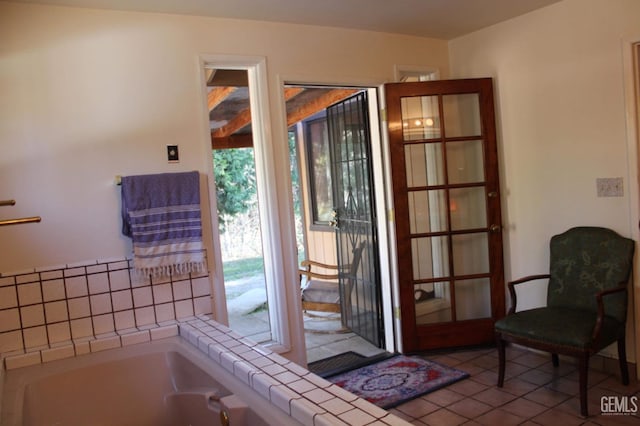 doorway to outside with tile patterned floors