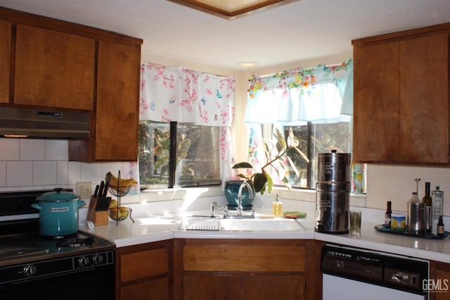 kitchen with decorative backsplash, sink, dishwasher, range, and range hood