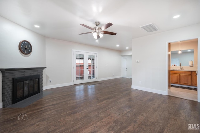 1800 Hughes Ln, Bakersfield, CA 93304 - unfurnished living room featuring ceiling fan, wood finished floors, recessed lighting, baseboards, and a brick fireplace