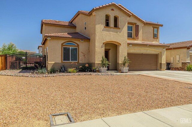 3647 Monument Hills Ave, Rosamond, CA 93560 - mediterranean / spanish house with stucco siding, an attached garage, driveway, and a tile roof