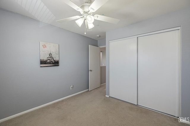 3647 Monument Hills Ave, Rosamond, CA 93560 - unfurnished bedroom with light carpet, a closet, and a ceiling fan