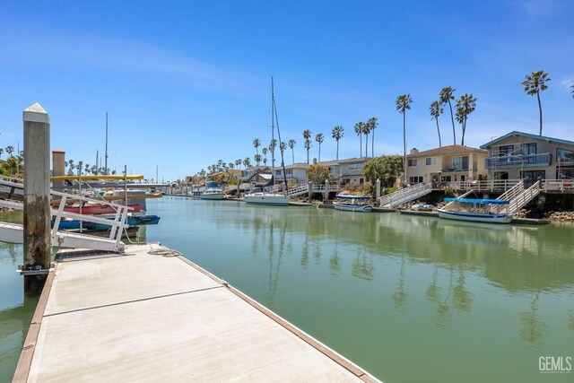 dock area with a water view