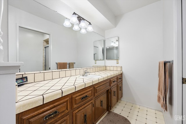 full bath with vanity and tile patterned floors