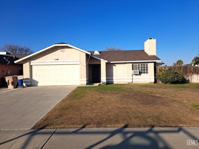 ranch-style home with a garage and a front yard