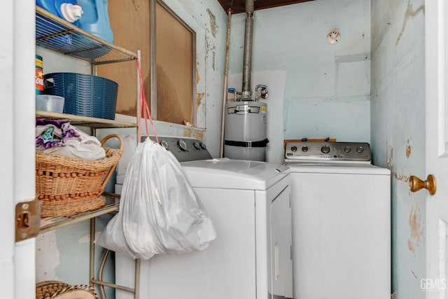 washroom with washer and clothes dryer and gas water heater