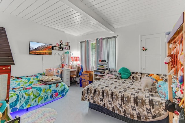 bedroom featuring beam ceiling and concrete floors